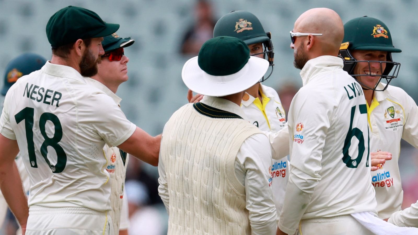 Australia's Nathan Lyon, third right, is congratulated by teammates after bowling the West Indies' Alzarri Joseph, Lyon's 450th test wicket, on the fourth day of their cricket test match in Adelaide, Sunday, Nov. 11, 2022. (AP Photo/James Elsby)