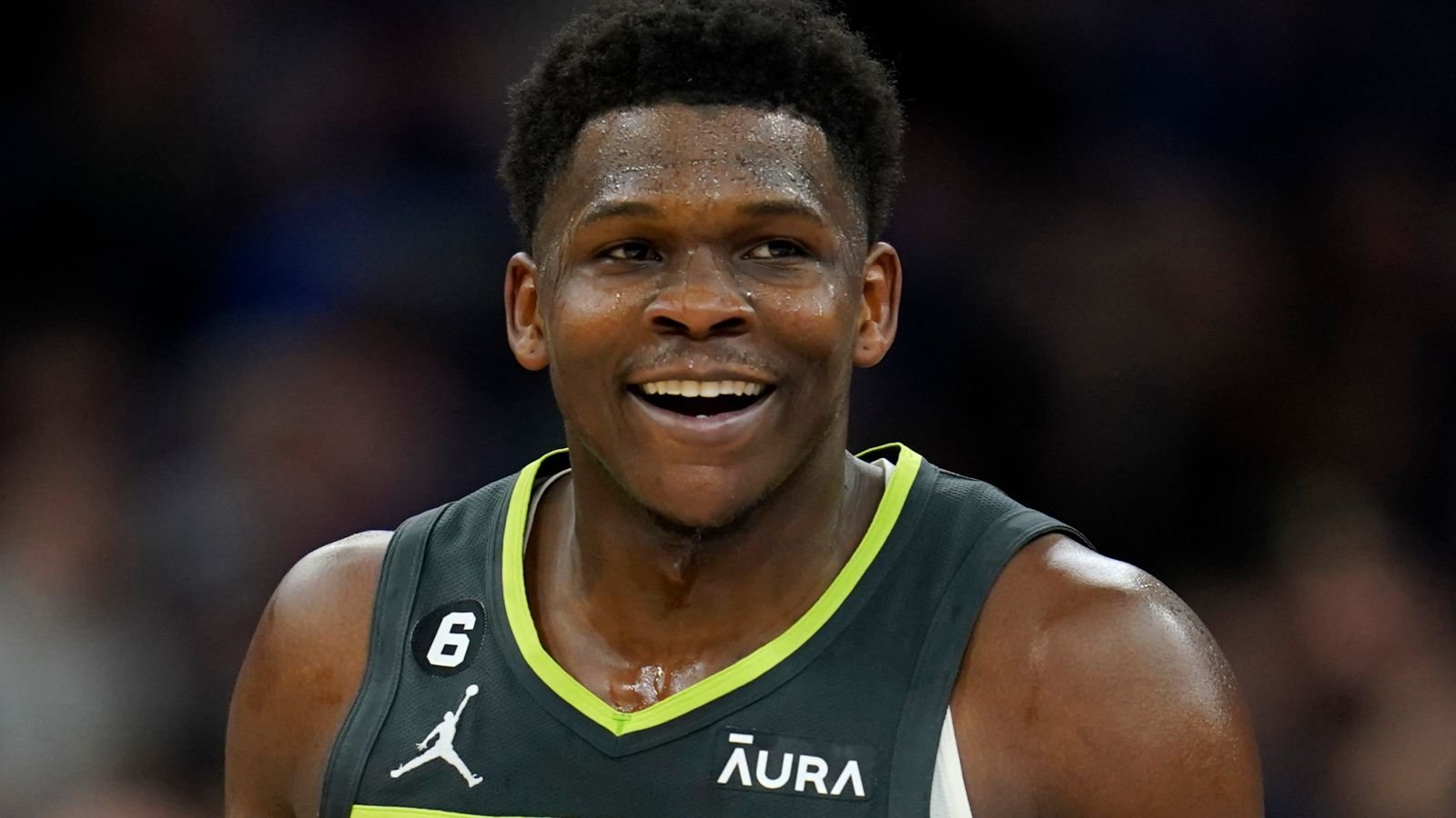 Minnesota Timberwolves guard Anthony Edwards (1) celebrates after making a three-point basket at the buzzer to end the third quarter of an NBA basketball game against the Denver Nuggets, Sunday, Feb. 5, 2023, in Minneapolis. (AP Photo/Abbie Parr)
