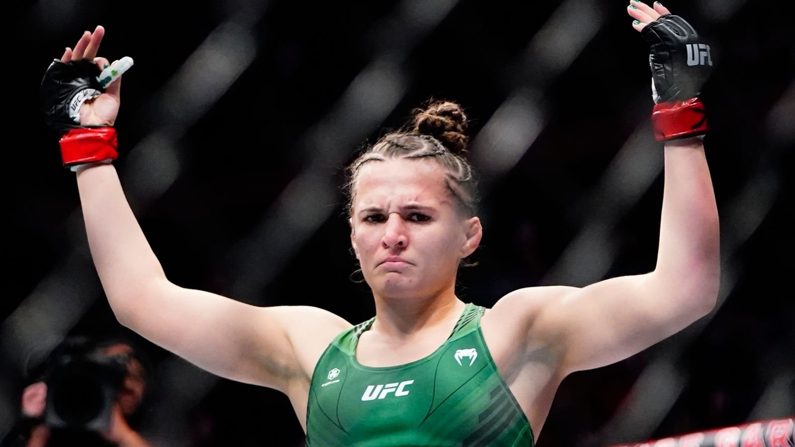 Erin Blanchfield celebrates after defeating Molly McCann, of England, in a women's flyweight bout at the UFC 281