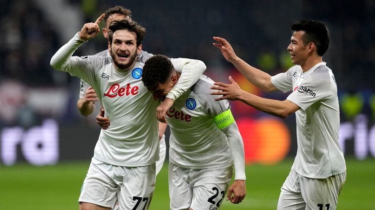 Napoli's Giovanni Di Lorenzo celebrates with team-mates after scoring his side's second goal against Eintracht Frankfurt