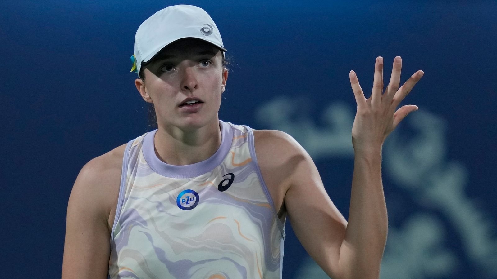 Poland's Iga Swiatek reacts against Canada's Leylah Annie Fernandez during a match of the Dubai Duty Free Tennis Championships in Dubai, United Arab Emirates, Tuesday, Feb 21, 2023. (AP Photo/Kamran Jebreili)