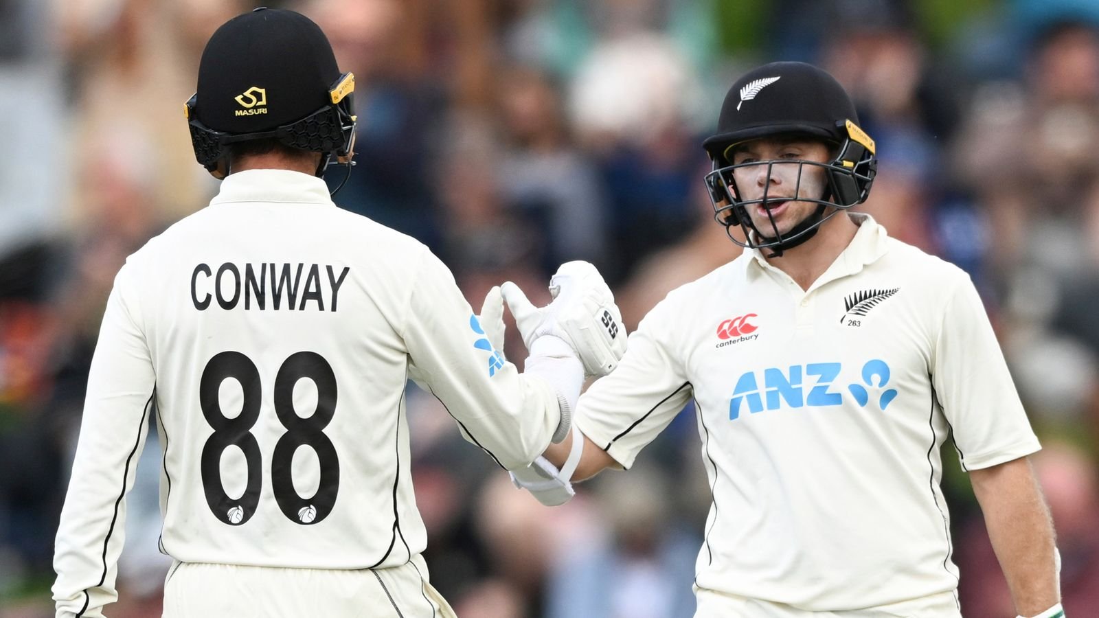 Tom Latham, right, and Devon Conway of New Zealand gesture on day three of the second cricket test between England and New Zealand at the Basin Reserve in Wellington, New Zealand, Sunday, Feb. 26, 2023. (Andrew Cornaga/Photosport via AP)