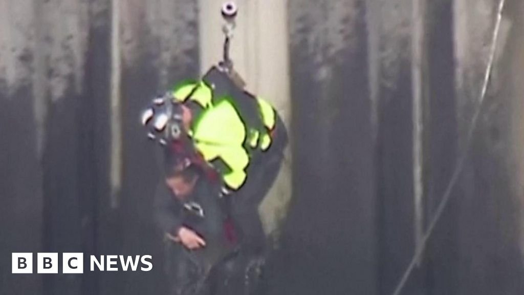 Watch: Man clings on for life in harrowing river rescue
