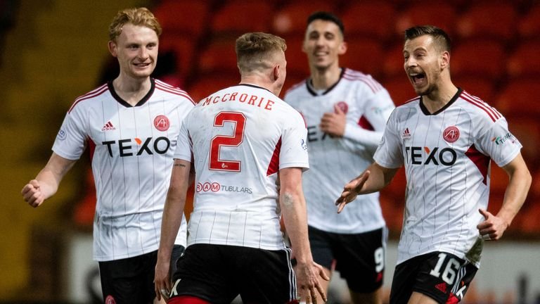 DUNDEE, SCOTLAND - MARCH 04: Aberdeen's Ross McCrorie celebrates with Ylber Ramadani after scoring to make it 2-1 during a cinch Premiership match between Dundee United and Aberdeen at Tannadice Park, on March 04, 2023, in Dundee, Scotland.  (Photo by Mark Scates / SNS Group)