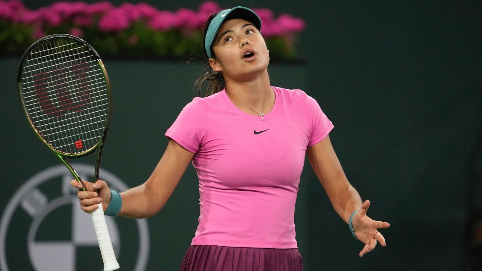 Emma Raducanu, of Britain, reacts after losing a point to Iga Swiatek, of Poland, at the BNP Paribas Open tennis tournament Tuesday, March 14, 2023, in Indian Wells, Calif. (AP Photo/Mark J. Terrill)