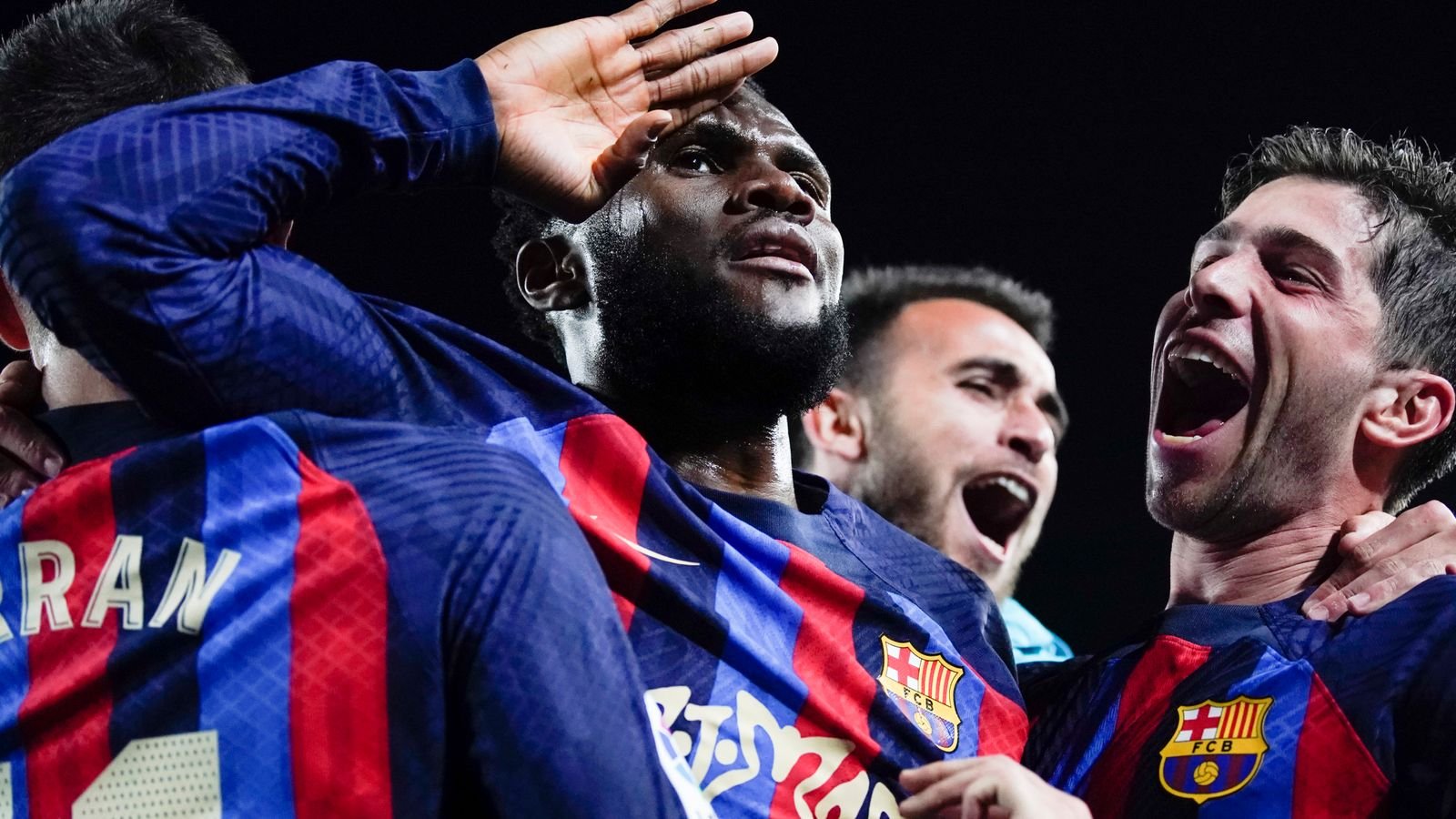 Barcelona's Franck Kessie, centre, celebrates with teammates after scoring his team's second goal during the Spanish La Liga soccer match between Barcelona and Real Madrid at Camp Nou stadium in Barcelona, Spain, Sunday, March 19, 2023. (AP Photo/Joan Mateu)