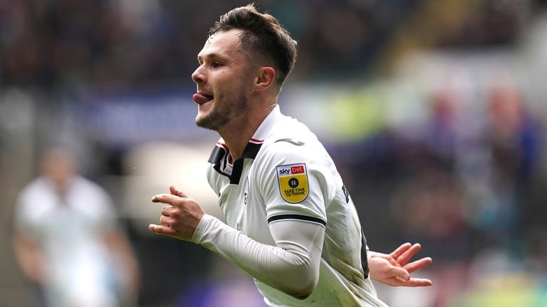 Liam Cullen wheels away to celebrate after opening the scoring for Swansea against Bristol City