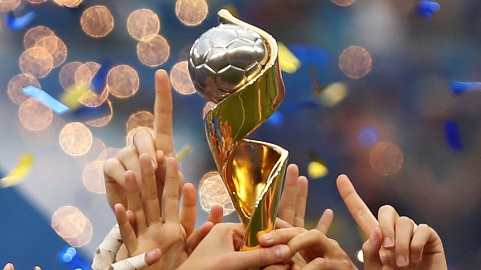 FILE - In this July 7, 2019, file photo, the United States players hold the trophy as they celebrate winning the Women's World Cup final soccer match against The Netherlands at the Stade de Lyon in Decines, outside Lyon, France. FIFA has received bids from Brazil, Japan, Colombia and a joint bid from Australia and New Zealand to host the 2023 Women's World Cup on Friday, Dec. 13, 2019. (AP Photo/Francisco Seco, File)